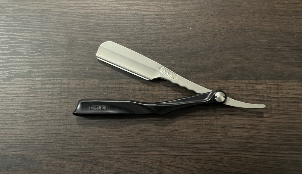 A black-handled SS razor