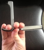 An image of a right hand holding a shavette.