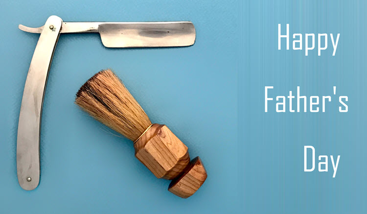 Straight razor and shaving brush on a light blue background with the words "Happy Father's Day" in white.