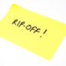 A picture of a yellow sticky note with the "RIP-OFF!" written on it.