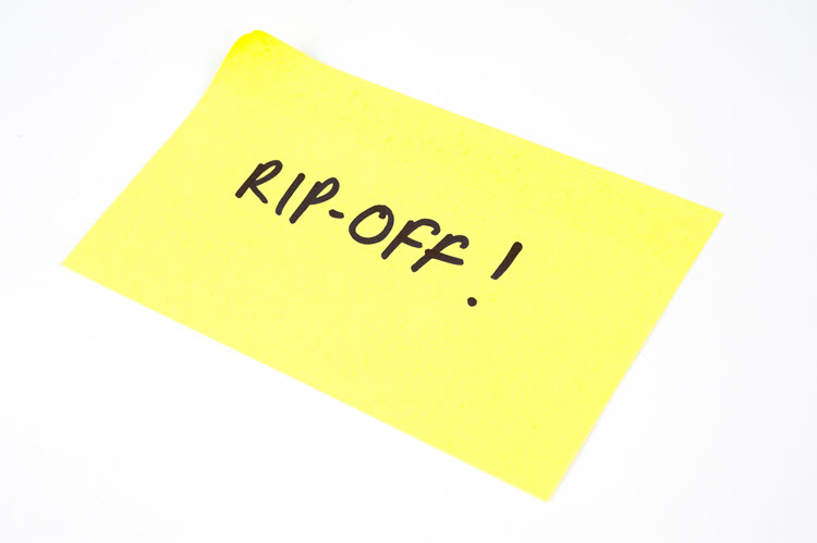 A picture of a yellow sticky note with the "RIP-OFF!" written on it.