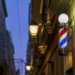 Barbershop Light Sign at Night with Blurred Street Lights Cadiz Andalusia Spain