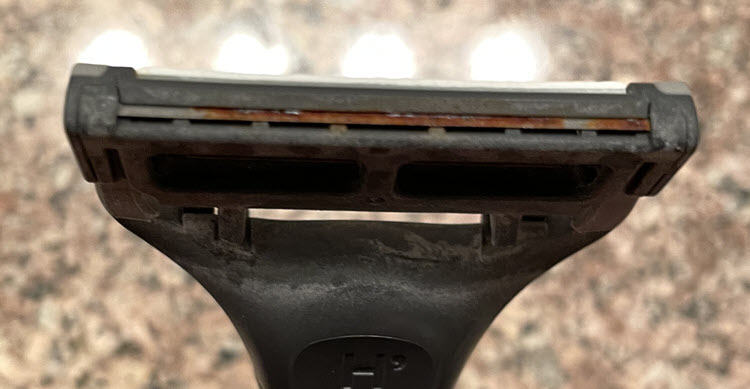 Rusted rear blade of Harry's razor cartridge after eighteen shaves.